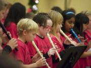 Fourth- and fifth-graders from Prune Hill Elementary School in Camas play recorders Saturday during a musical program at the annual Festival of Trees at the Hilton Vancouver Washington.