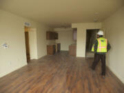 Charles Johnston, construction project manager from Prestige Development, tours one of 96 apartment units at Prestige Place, set to open in early 2014.