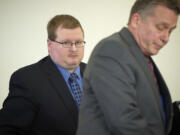 Sean Doucette, left, with his attorney Steven Thayer, walks from Judge Daniel Stahnke's courtroom this afternoon after charges of second-degree murder against him were dismissed.