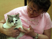 Walnut Grove: Furry Friends volunteer Jan Berg with Jack Frost at the shelter&#039;s Give More!