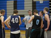 Hockinson boys basketball coach Trevor Person works with his seniors on Tuesday.