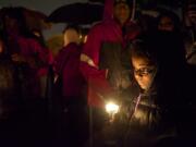 Harmony Jones participates in a candlelight vigil for Donna Franchino, the victim of a fatal house fire Friday.