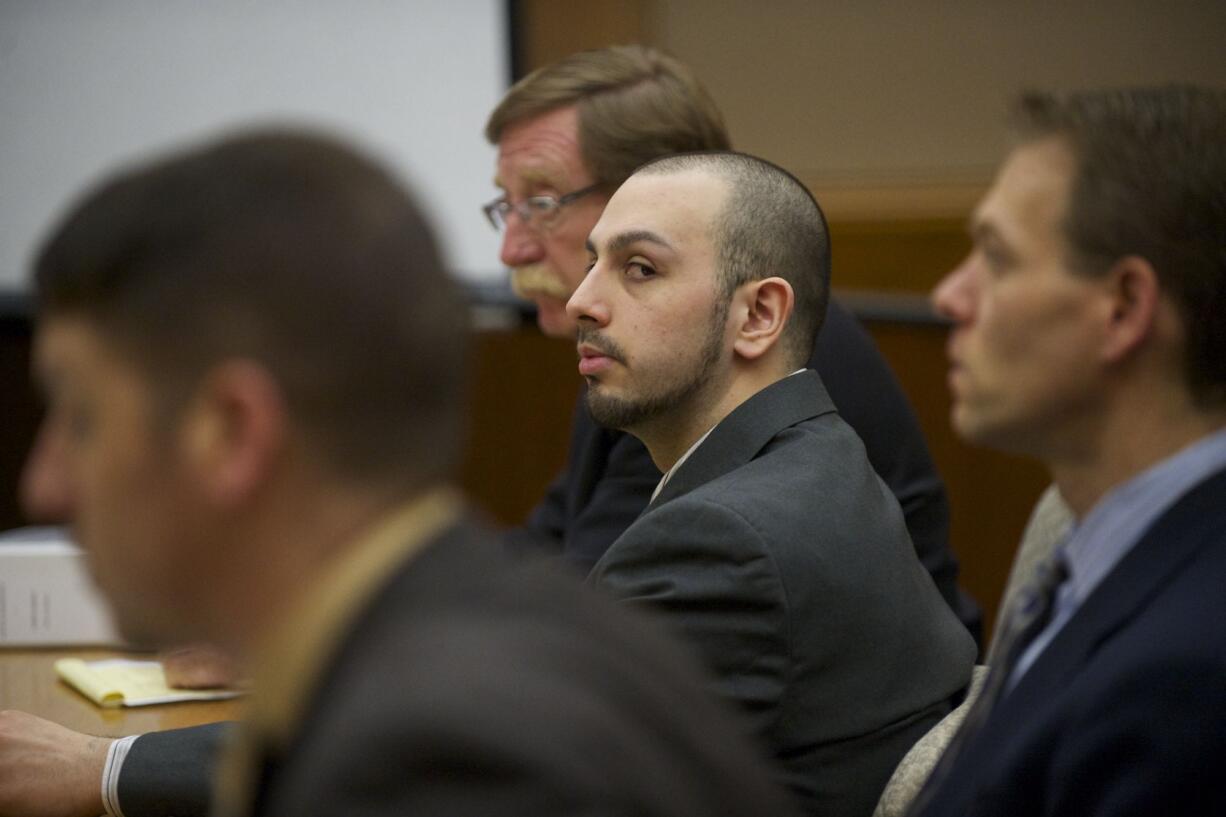 Pedro Godinez Jr. waits for opening statements Tuesday in his trial in Clark County Superior Court Judge Barbara Johnson's courtroom.