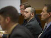 Pedro Godinez Jr. waits for opening statements Tuesday in his trial in Clark County Superior Court Judge Barbara Johnson's courtroom.