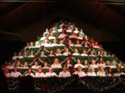 Choir members are nestled in the constructed tree like ornaments for the annual Singing Christmas Tree performances at the Ridgefield Church of the Nazarene.