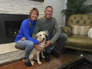 Sara and Josh Boelter with Luna, the dog they adopted through Operation Bagdad Pups, who Josh met while serving with the Oregon Air National Guard in Romania.