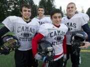 Members of the Camas football scout team, from left, Aaron Deml, Dustin Krecklow, Jordan Del Moral and Blake Roy,