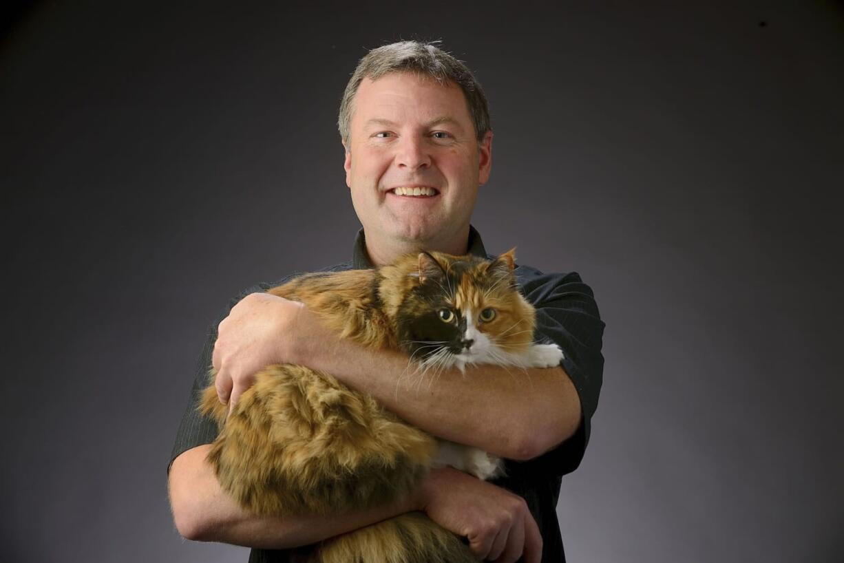 Scott Weissbeck and Mao, his Norwegian Forest cat. Mao was diagnosed with a rare disease earlier this year.