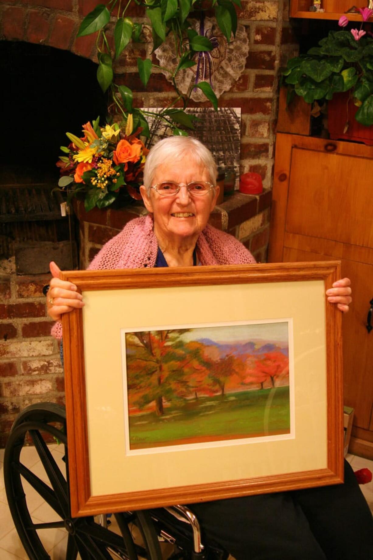 Hazel Dell: Kathleen New, 88, holds her &quot;Montreal Autumn&quot; painting.