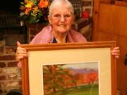 Hazel Dell: Kathleen New, 88, holds her &quot;Montreal Autumn&quot; painting.