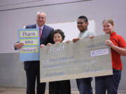 Vancouver Heights: OnPoint Community Credit Union President Robert Stuart, from left, presents a $5,000 donation Nov.