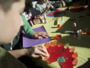 Jason Bernheimer, 13, works on a cross between a turkey and a menorah on Sunday  as he and other children at Congregation Kol Ami celebrate the fact that the first day of Hanukkah and Thanksgiving fall on the same day, making it Thanksgivukkah.