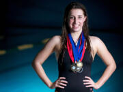 Monica Bottelberghe battle back from thyroid surgery in August to win her third Class 3A state title in the 200-yard freestyle.