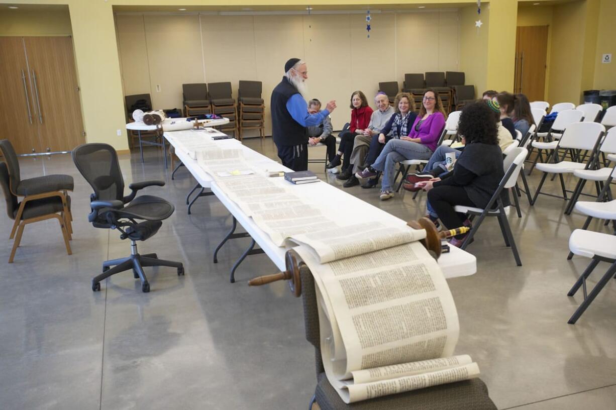 Rabbi Gedaliah Druin teaches about Torah care at Congregation Kol Ami on Thursday.