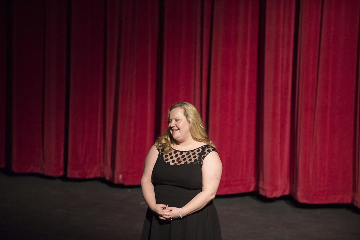 Director Margaret Gorman, Evergreen High School's new drama teacher, greets the audience before "The Three Musketeers" on Thursday at Evergreen High School's theater.