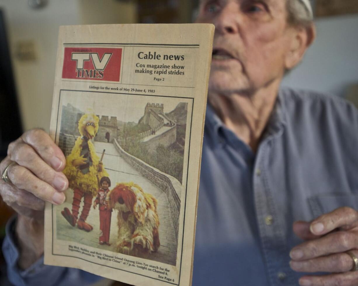 Vancouver veteran Paul Johnson holds a copy of a 1983 Columbian TV booklet.