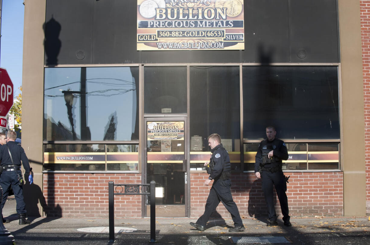 Police at the scene of a shooting at a shop in downtown Vancouver, Wednesday November 25, 2015. Early reports indicated one fatality, according to emergency radio traffic.