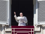 Pope Francis delivers his blessing during the Angelus noon prayer he celebrated from the window of his studio overlooking St. Peter&#039;s Square, at the Vatican on Sunday.