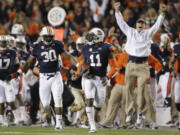 Auburn cornerback Chris Davis (11) returns a missed field-goal attempt 100-plus yards to score the game-winning touchdown as time expired.