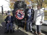 David Thatcher, from left, Edward Saylor, and Richard Cole, three of the four surviving members of the 1942 Tokyo raid led by Lt. Col. Jimmy Doolittle, pose Saturday at a monument marking the raid outside the National Museum for the U.S. Air Force in Dayton, Ohio.