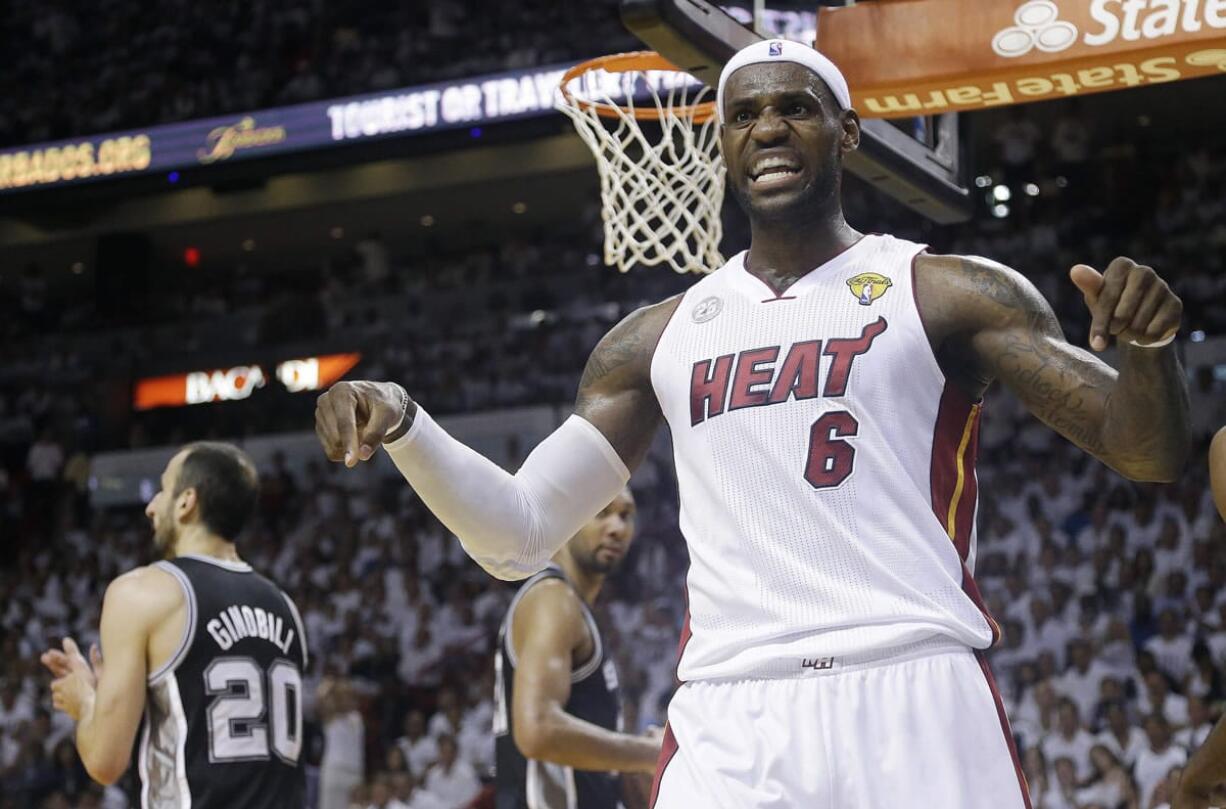 LeBron James reacts after being fouled during the second half in Game 7 of the NBA basketball championship against the San Antonio Spurs.