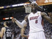 LeBron James reacts after being fouled during the second half in Game 7 of the NBA basketball championship against the San Antonio Spurs.