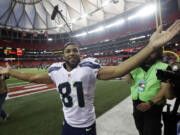 Seattle Seahawks wide receiver Golden Tate (81) celebrates after the second half of an NFL football game against the Atlanta Falcons, Sunday, Nov. 10, 2013, in Atlanta. Seattle Seahawks won 33-10.