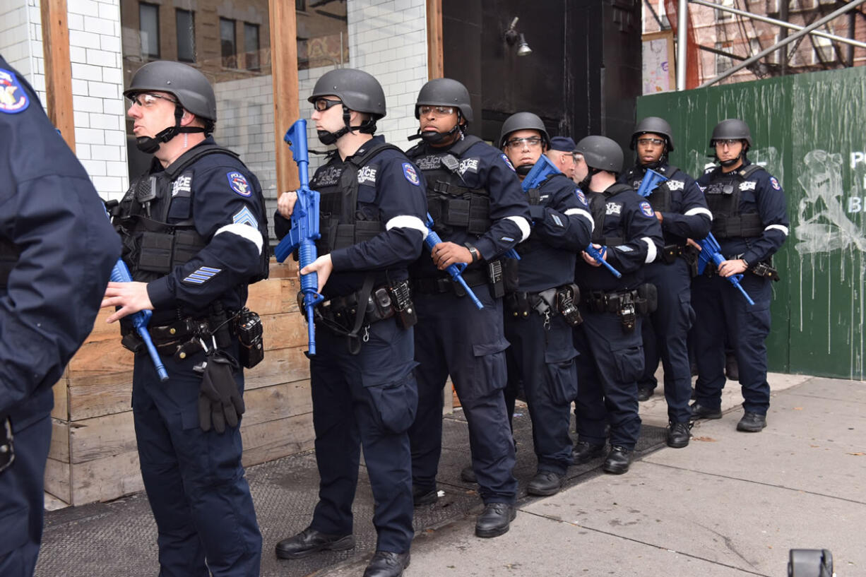 FILE - In this Sunday, Nov. 22, 2015, file photo, provided by the New York Police Department, NYPD officers line up near an abandoned subway station to stage a drill simulating an attack, in New York. Since the Paris attacks, U.S. police officials and security experts have been hammering home the hard realities of so-called &quot;active shooter&quot; incidents. Officials believe the best chance to preserve life is for ordinary police officers not to hesitate to charge in and kill the attackers.