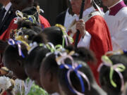 Pope Francis celebrates a mass Monday in the Barthelemy Boganda Stadium in Bangui, Central African Republic. The pontiff returned to Italy on Monday after a visit to Africa.