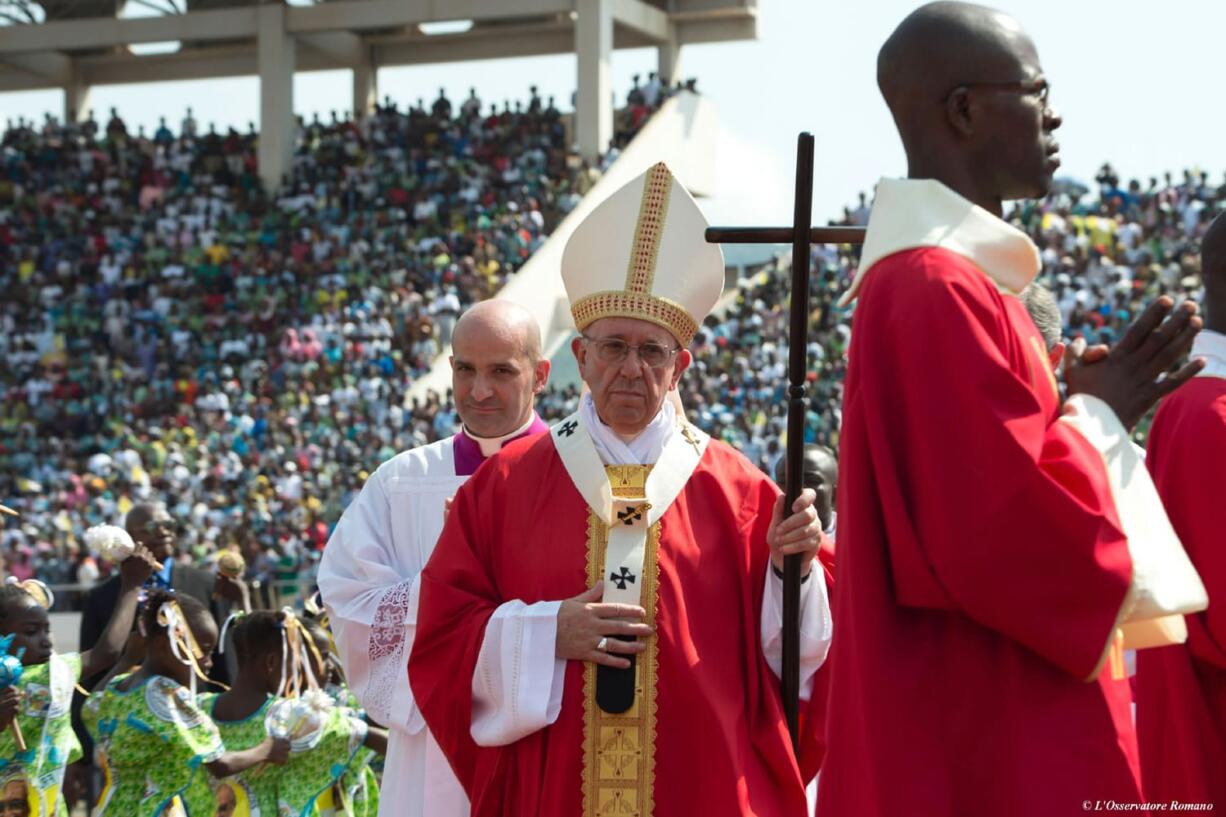 Pope Francis celebrates a mass in the Barthelemy Boganda Stadium, in Bangui, Central African Republic, on Monday. The pontiff is on his way back to Italy after a two-day visit to Central African Republic. After a final Mass at the sports stadium in Bangui, the pope&#039;s motorcade headed to the airport where his plane has now taken off.