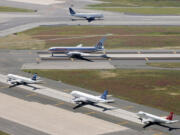 Taxiing planes line up on runways at John F. Kennedy International Airport in New York.