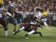 Arizona State quarterback Taylor Kelly gets past Washington State safety Taylor Taliulu (30) to score a touchdown as Arizona State.