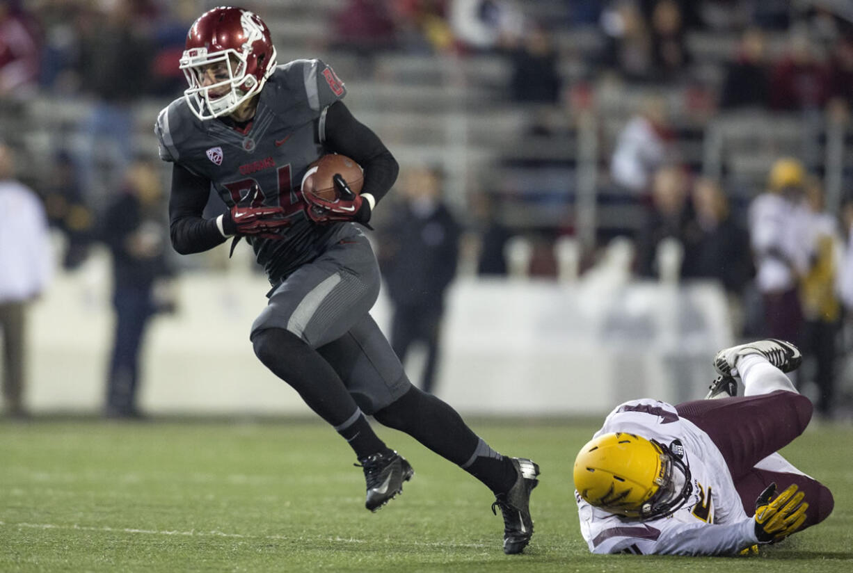 Washington State wide receiver River Cracraft (84) gets past Arizona State linebacker Steffon Martin (2).