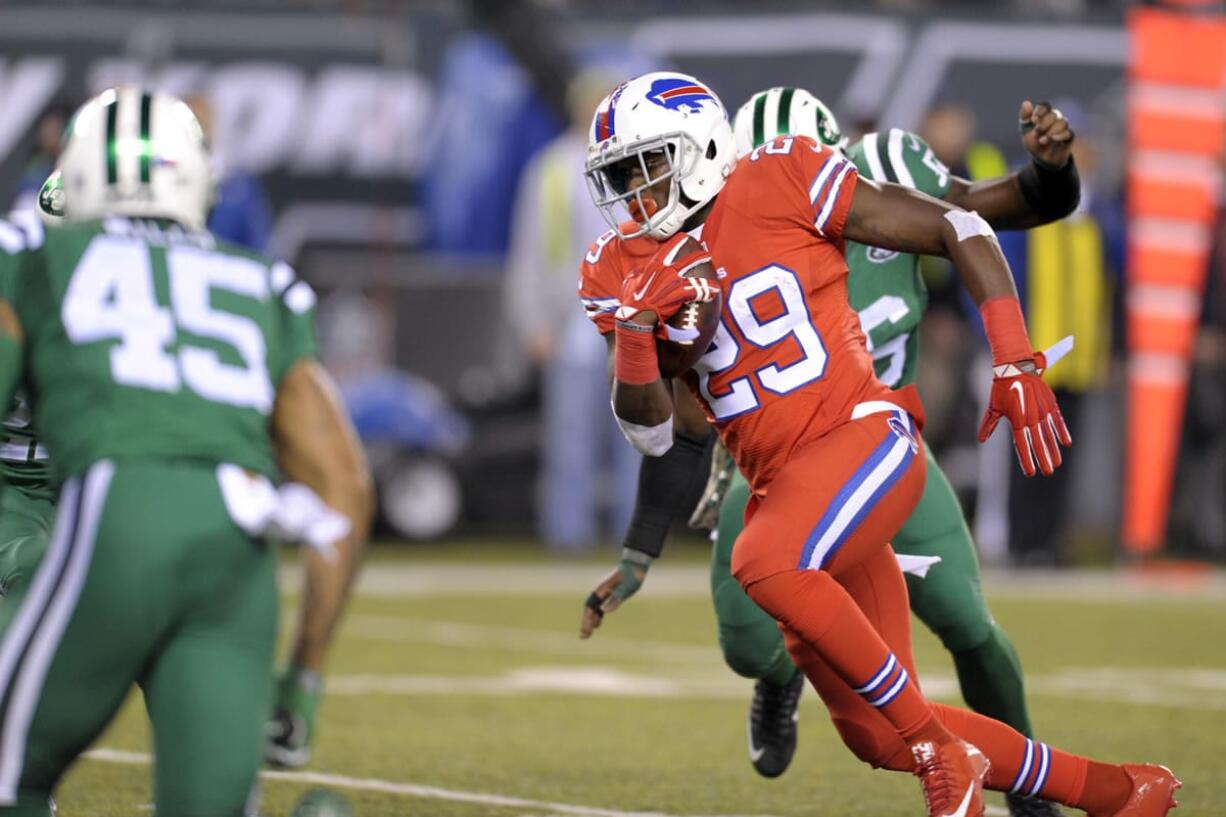 Buffalo Bills running back Karlos Williams (29) scores on a touchdown pass from Buffalo Bills quarterback Tyrod Taylor, not pictured, during the second half of an NFL football game against the New York Jets, Thursday, Nov. 12, 2015, in East Rutherford, N.J.