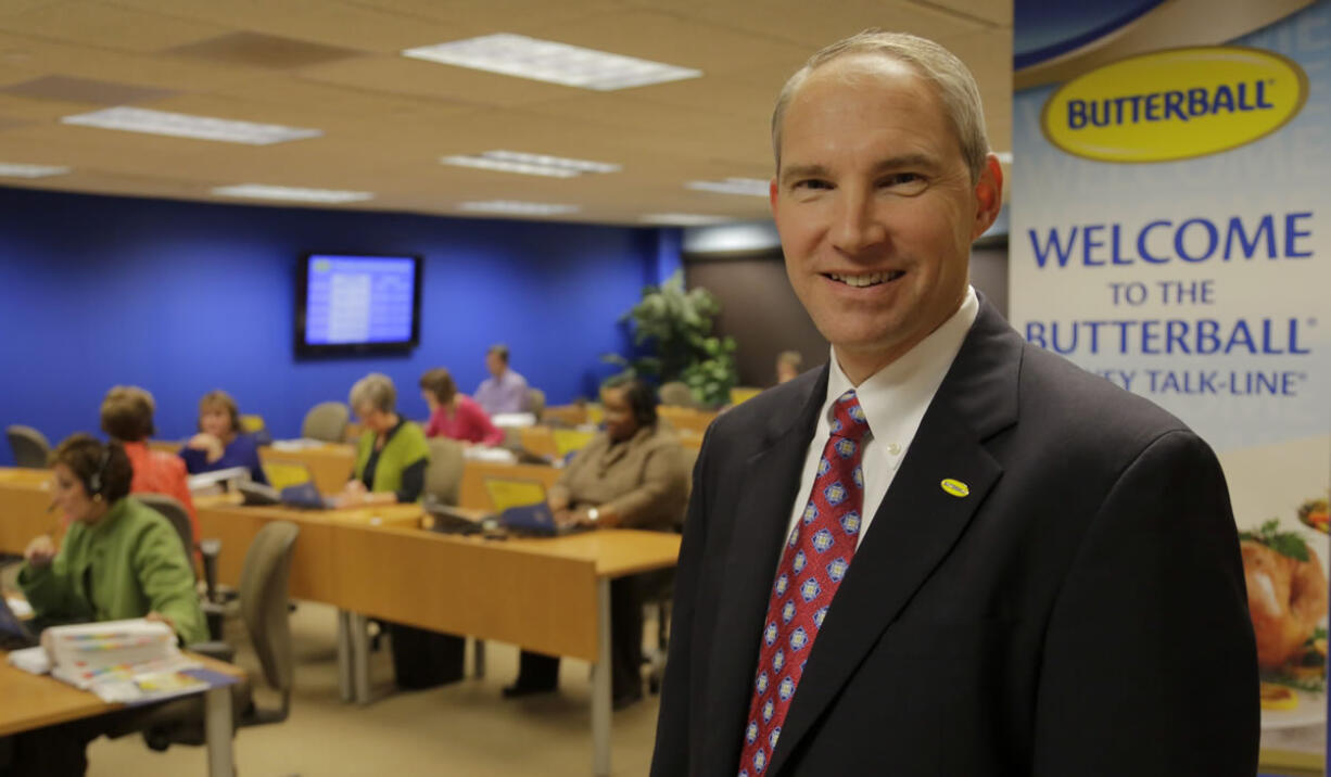 Butterball Turkey CEO Rod Brenneman stands in front of a group of Turkey Talk-Line experts at work in Naperville, Ill.