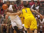 The ball bounces off Washington State forward D.J. Shelton (23) after California guard Justin Cobbs (1) deflected a pass during the second half Wednesday. California won 80-76.