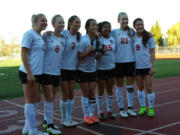 The seniors of the Camas girls soccer team with the WIAA third place state trophy on Saturday, Nov. 21, 2015.