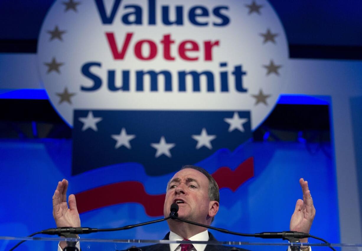 Republican presidential candidate and former Arkansas Gov. Mike Huckabee speaks in September during the Values Voter Summit, held by the Family Research Council Action, in Washington. Some leading Republican presidential candidates seem to view Muslims as fair game for increasingly harsh words they might not dare use against any other group for fear of the political cost. So far, that strategy is winning support from conservatives influential in picking the nominee.