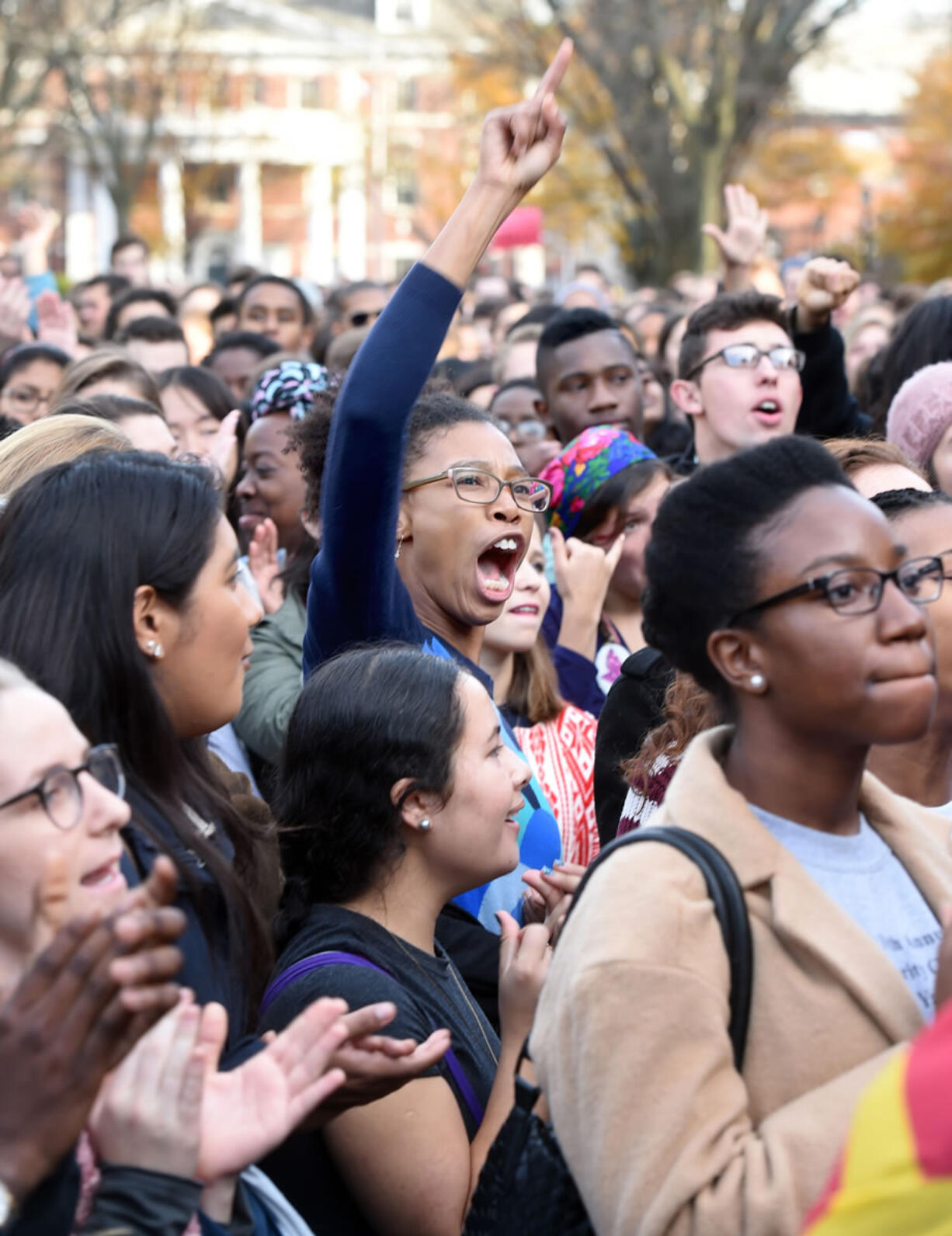 Yale University students and faculty rally Nov. 9 on the campus in New Haven, Conn., to demand that Yale University become more inclusive to all students. At schools including Michigan and Yale, students say the protests that led to the resignation of University of Missouri President Tim Wolfe and another administrator are emboldening them to take a harder line.