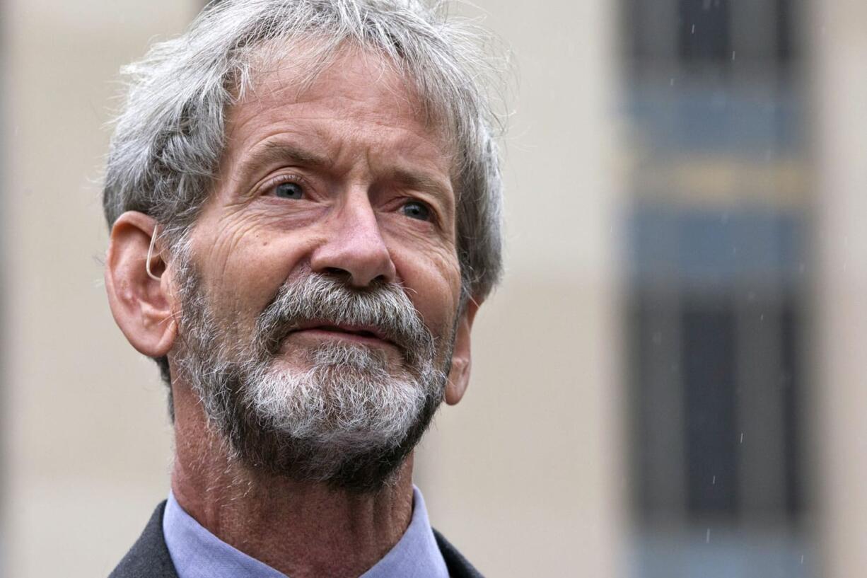 Douglas Hughes of Florida speaks to reporters May 21 outside federal court in Washington. Hughes, who flew a gyrocopter through some of America&#039;s most restricted airspace before landing outside the U.S. Capitol earlier this year, will plead guilty in connection with the incident, his lawyer says. Hughes is expected to plead guilty to operating a gyrocopter without a license, a felony, on Nov. 20.