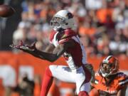 Arizona Cardinals wide receiver Jaron Brown (13) brings in a catch for a first down during a Nov. 1 game at Cleveland.