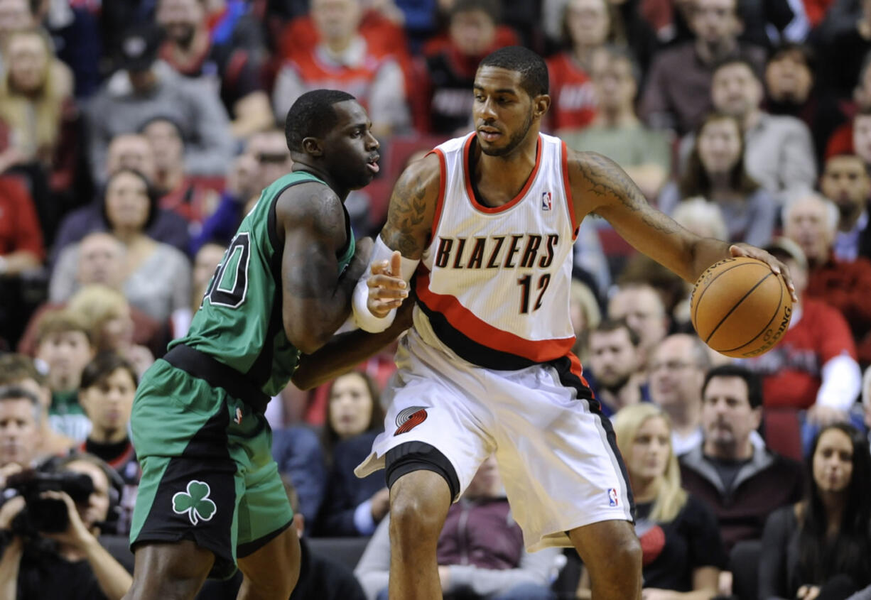 Boston Celtics' Brandon Bass (30) defends against Portland Trail Blazers' LaMarcus Aldridge (12) during the first half of an NBA basketball game in Portland, Ore., Saturday, Jan. 11, 2014.