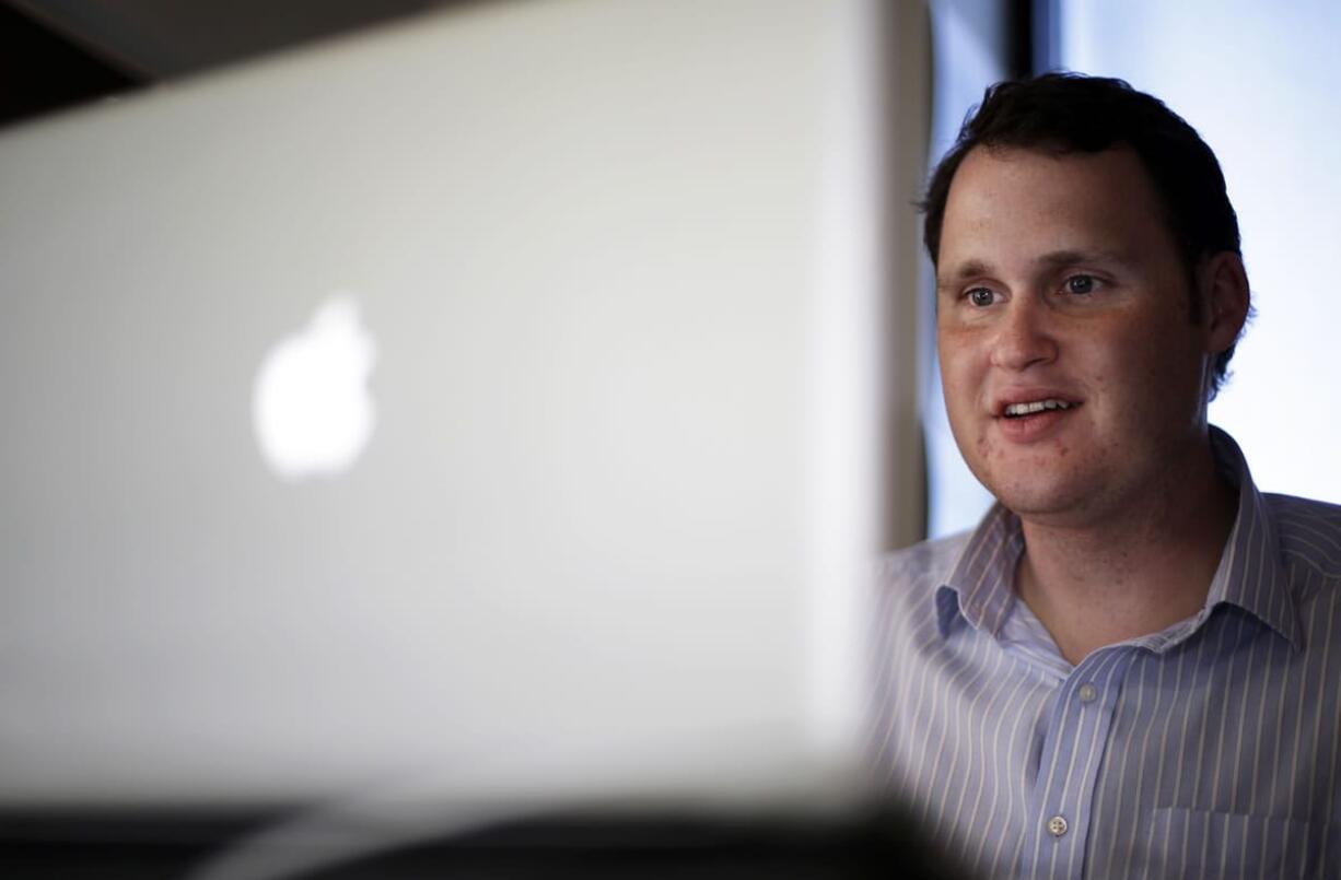 Jeremy Bills works at his job as associate director at the Nashville Education Community and Arts Television office on Wednesday in Nashville, Tenn.