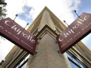 Signage hangs from a closed Chipotle restaurant in Portland on Monday. Chipotle voluntarily closed down 43 of its locations in Washington and the Portland area as a precaution after an E. coli outbreak linked to six of its restaurants in the two states has sickened dozens of people.