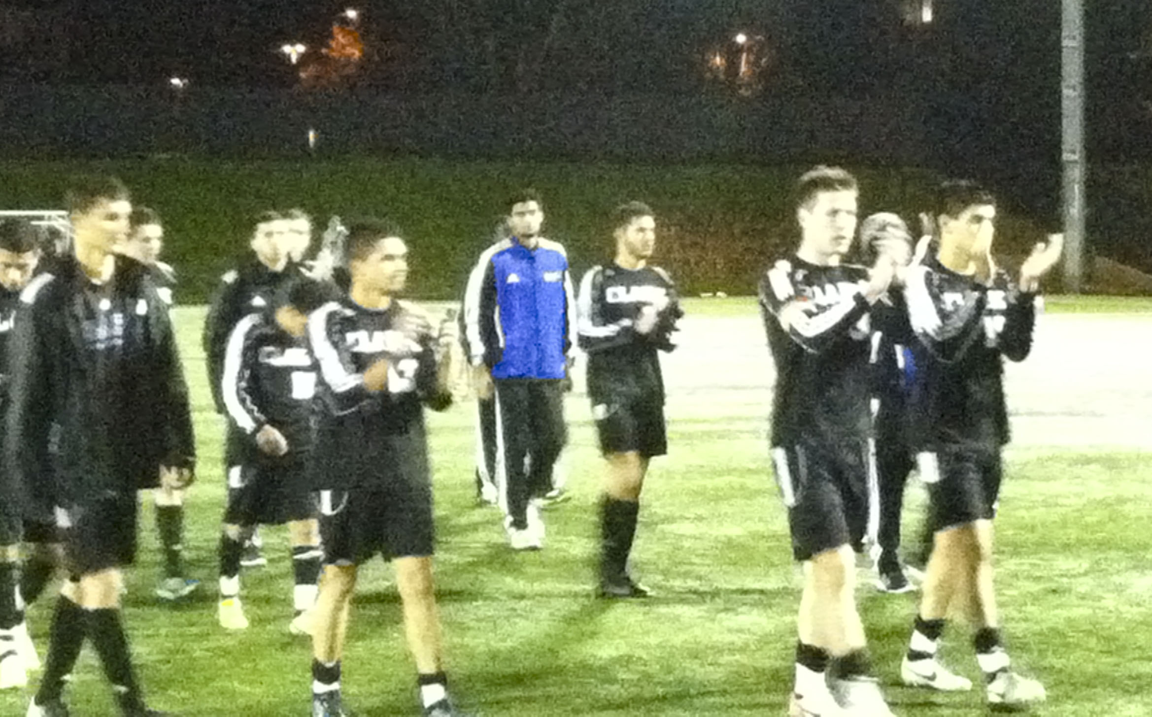 Clark College soccer players applaud their supporters following Sunday's 1-0 loss to Peninsula in the NWAACC championship match at Starfire Complex in Tukwila.