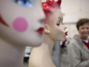 Sherry Ungrodt, right, glances at antique mannequin heads once used to display jewelry at an antique show inside the Event Center at the Clark County Fairgrounds in 2009.