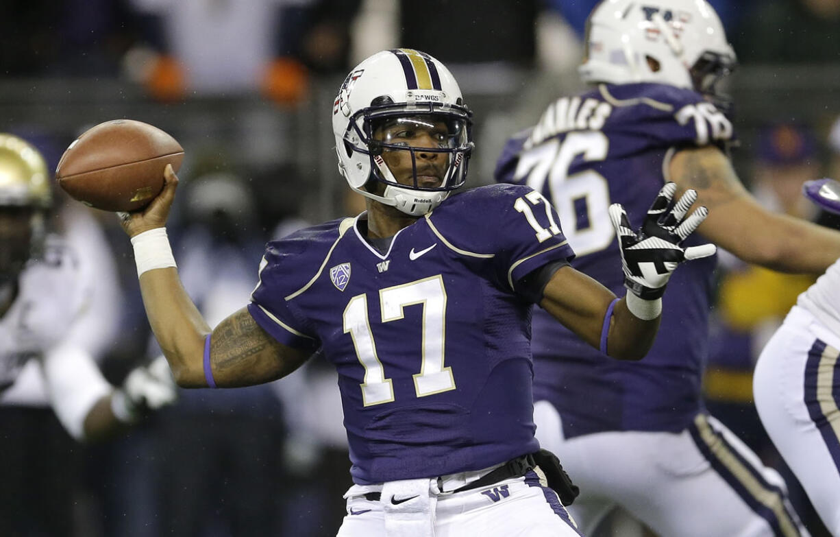 Washington quarterback Keith Price is uncertain whether he'll play Saturday against Oregon State. (AP Photo/Ted S.