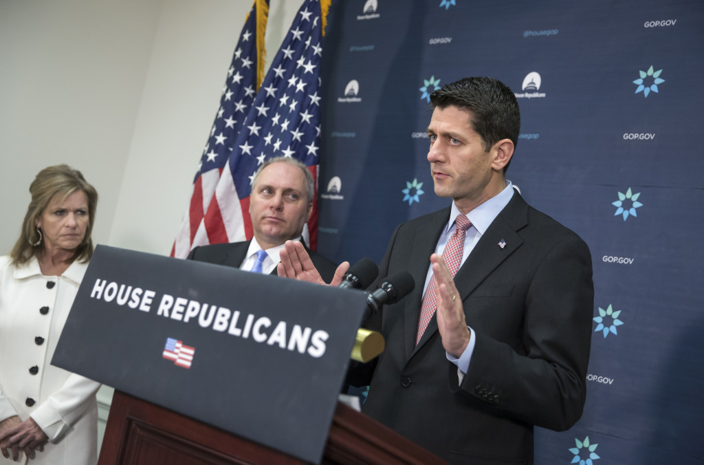 House Speaker Paul Ryan of Wis., joined by House Majority Whip Steve Scalise of La., center, and Rep. Lynn Jenkins, R-Kansas, meets with reporters on Capitol Hill in Washington on Tuesday following a GOP strategy session. Calling this a "moment where it's better to be safe than to be sorry," Ryan said there should be a "pause" in Syrian refugees coming to the U.S. in the wake of the Paris attacks, and has assembled a task force to bring legislation to a vote as soon as this week.  (AP Photo/J.