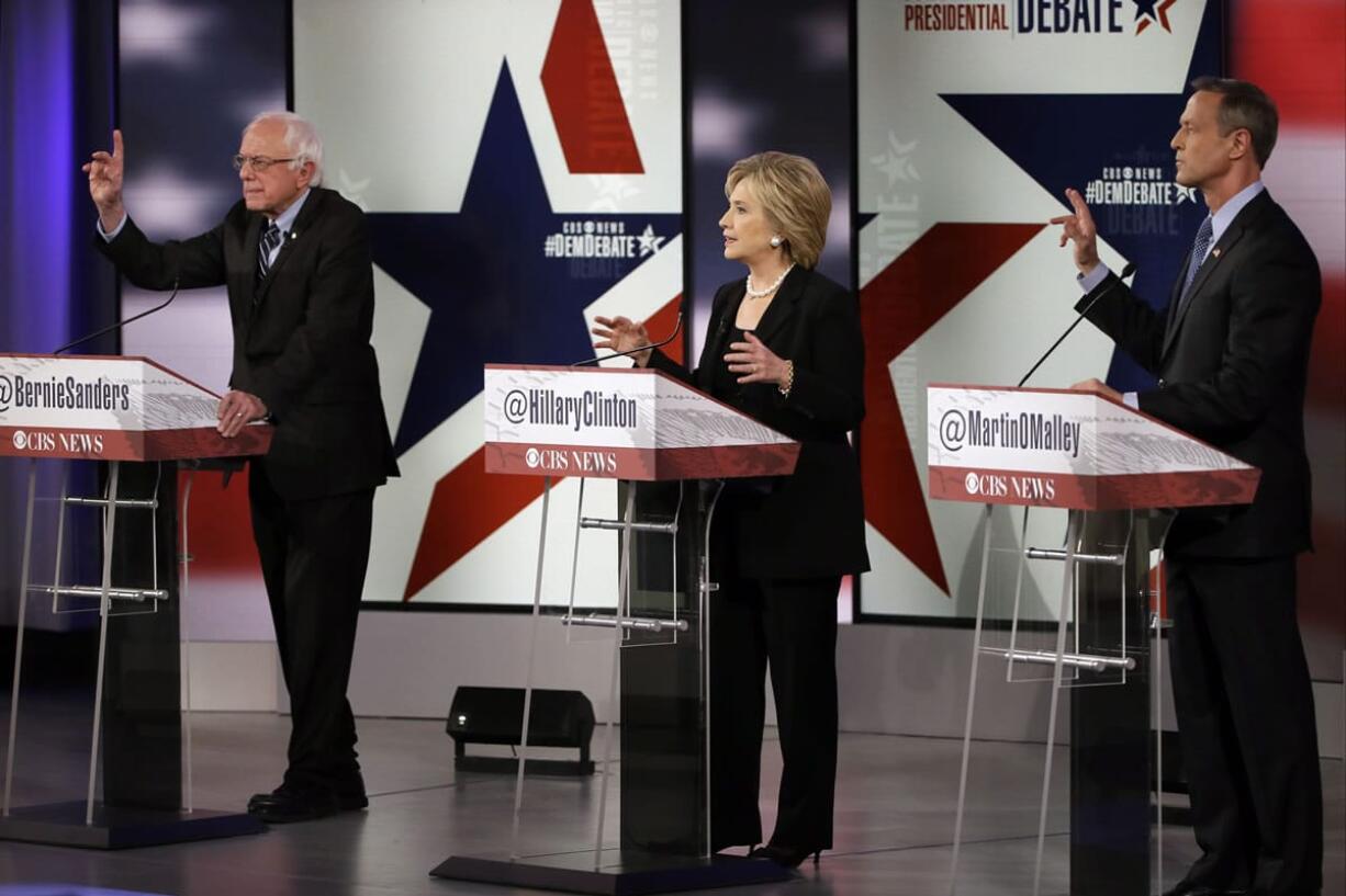 Presidential candidates Bernie Sanders, left, Hillary Rodham Clinton and Martin O&#039;Malley participate in a Democratic presidential primary debate Saturday  in Des Moines, Iowa.