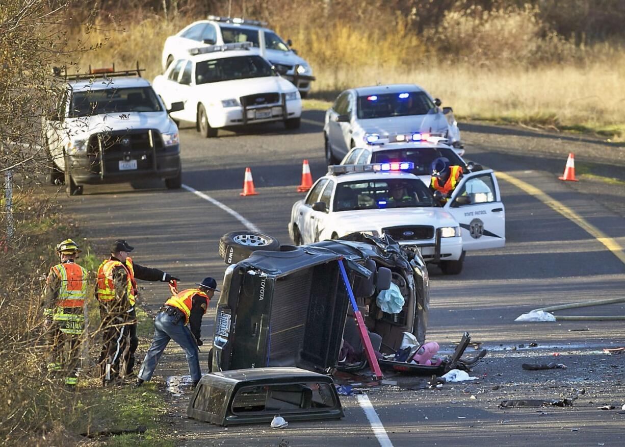 Crews respond to a collision on Instate 205 in Vancouver on Wednesday. Craig Johnson died after his vehicle collided with this truck.